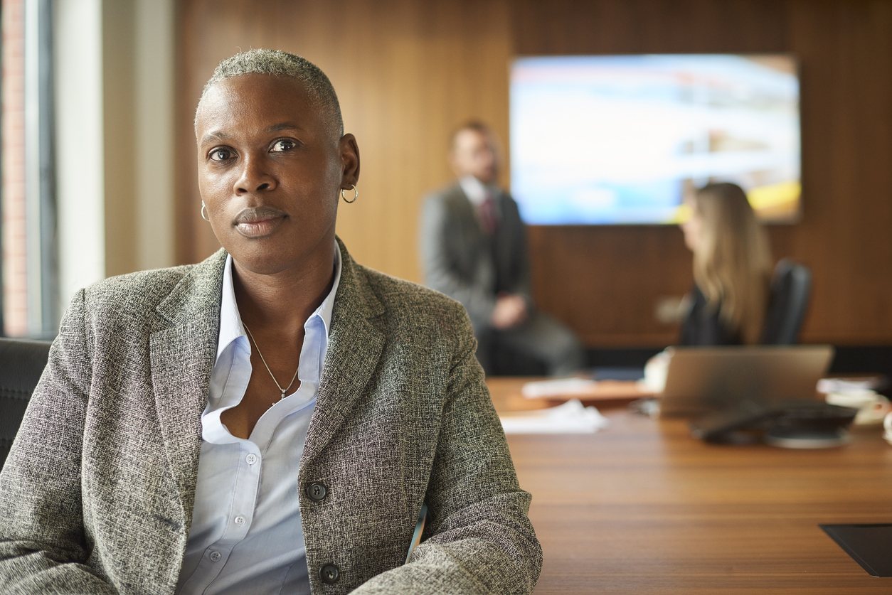 A director in the boardroom before a board meeting