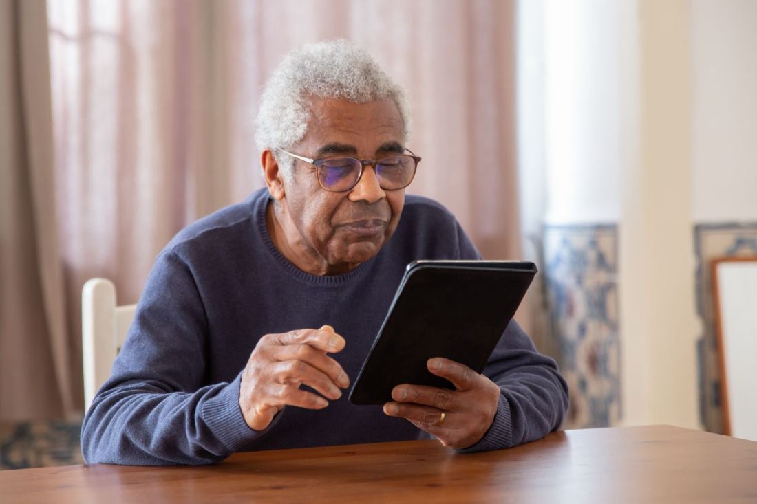 A director asking a question on a tablet